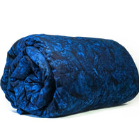A rolled-up weighted blanket with a blue minky fabric.