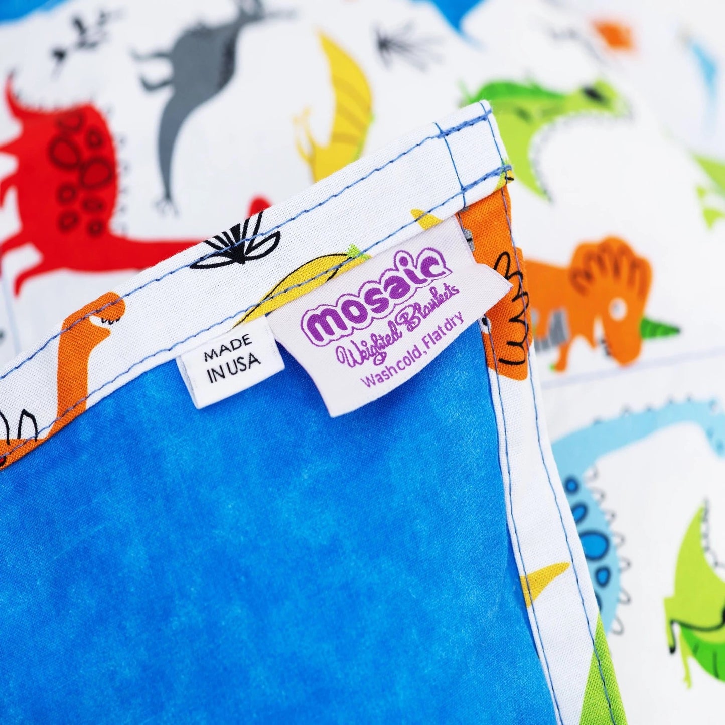 The Made in America Mosaic Weighted Blankets Dinosaur Weighted Blanket tag closeup