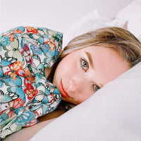 Woman under her Green and Blue Butterflies Weighted Blanket