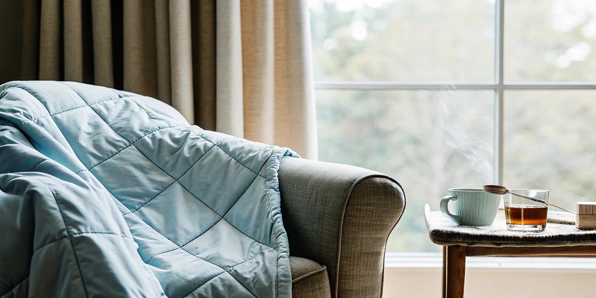 A weighted throw blanket on a chair, offering the benefits of deep comfort and stress relief.