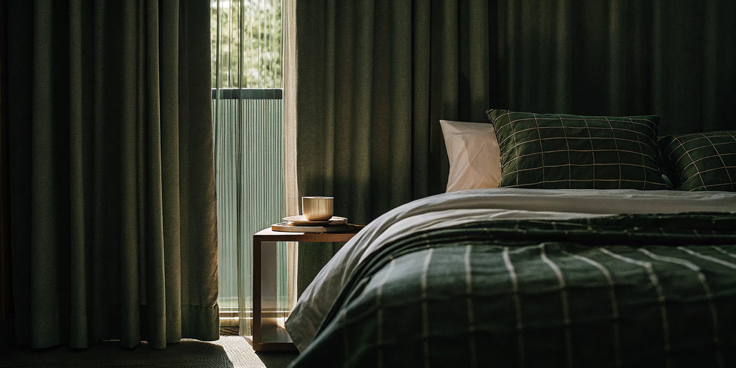 Breathable cotton weighted blanket on a bed for cool, comfortable sleeping.