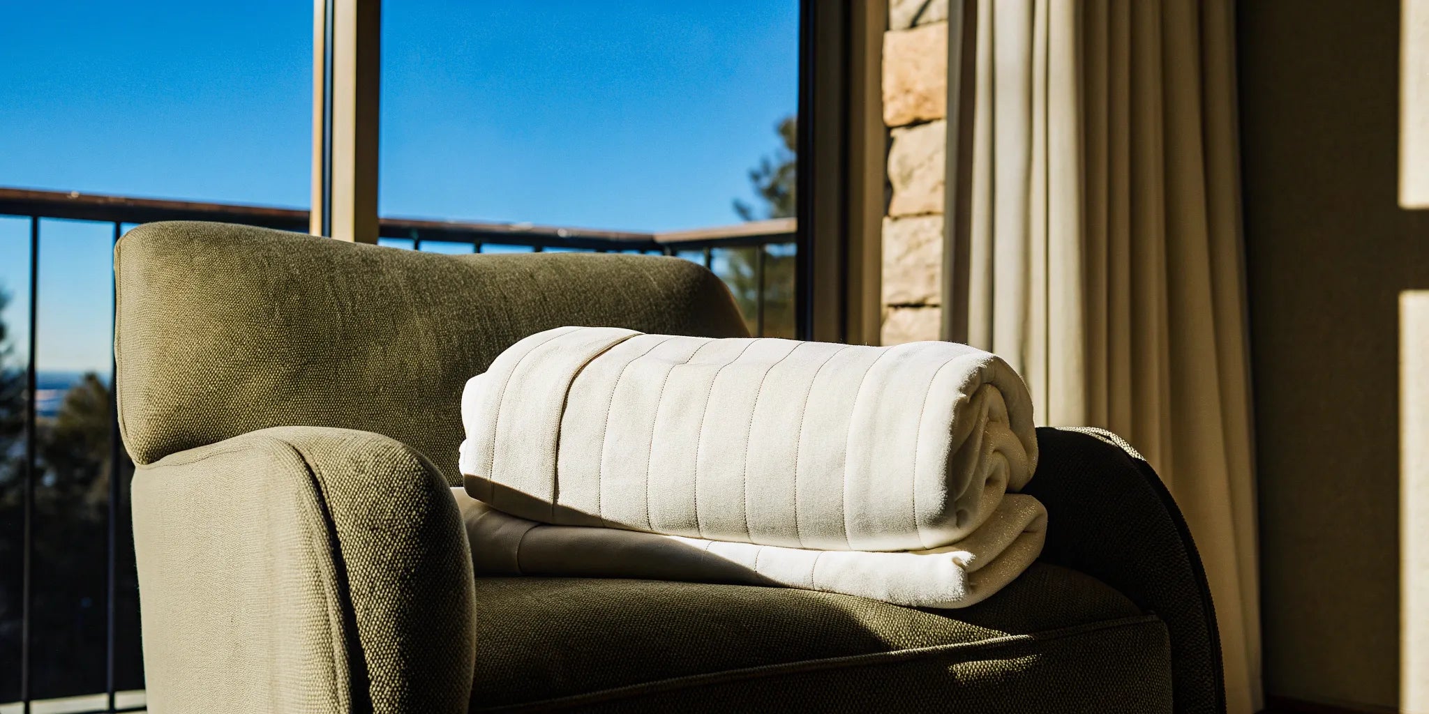 The benefits of a weighted shoulder wrap for stress relief, shown with the wrap resting on an armchair.