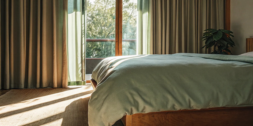 A 20lb cooling weighted blanket on a bed, designed for hot sleepers.