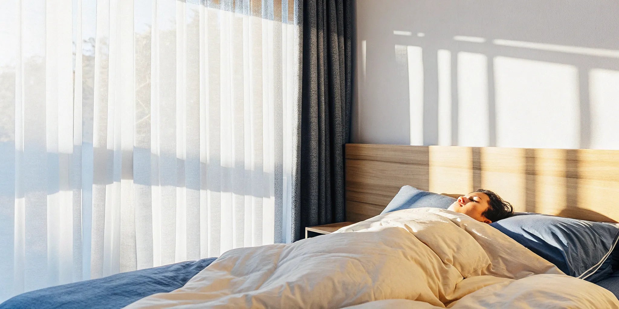 A person stays cool while sleeping under a breathable cotton weighted blanket.