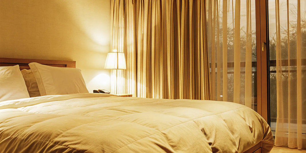 A king size weighted blanket providing full coverage on a bed for effective, restful sleep.