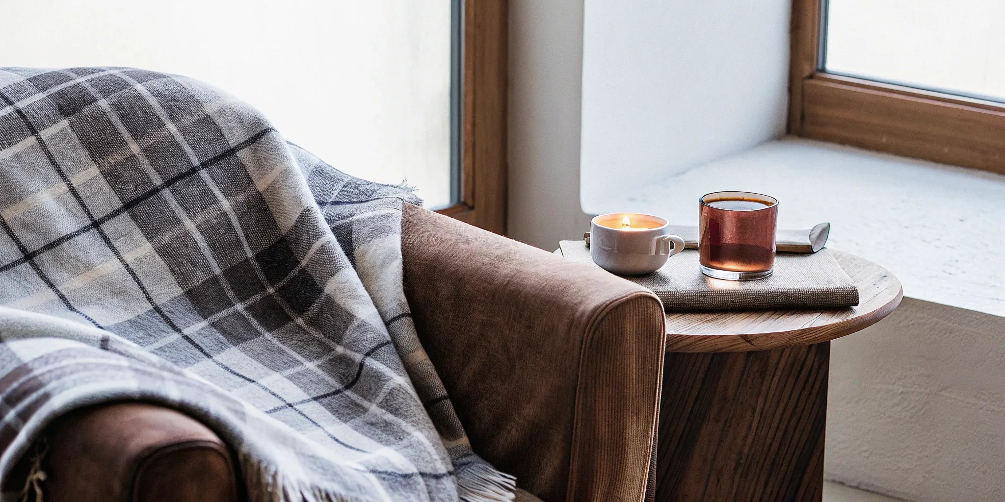 A top-rated consumer weighted throw blanket resting on a chair.