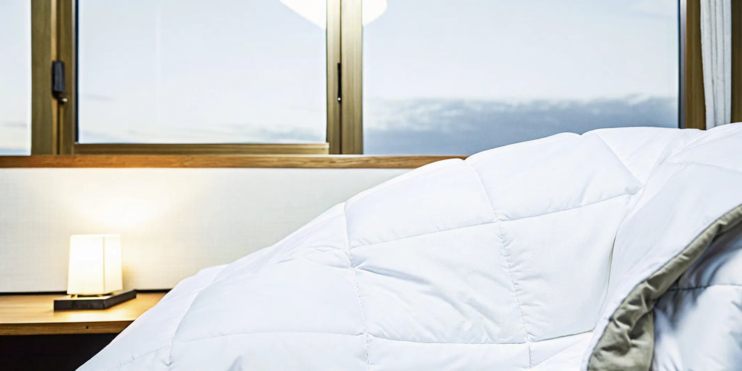 A weighted blanket on a bed, a top choice to buy for deep sleep.