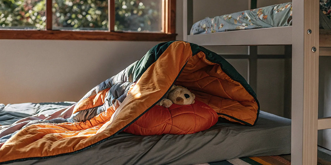 A kids sensory blanket on a bed, showing what to look for when you buy one for your child online.