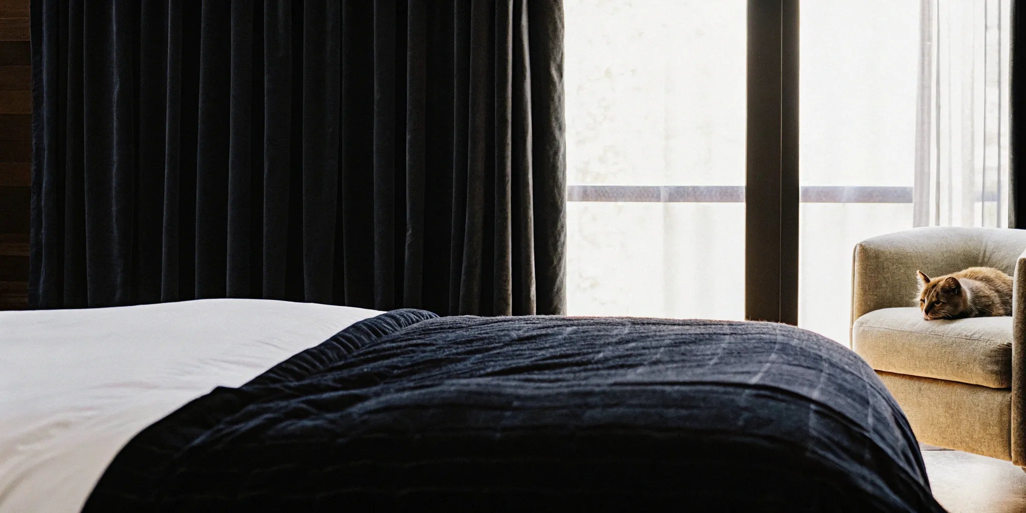 A weighted blanket on a bed for deep pressure therapy and improved sleep.