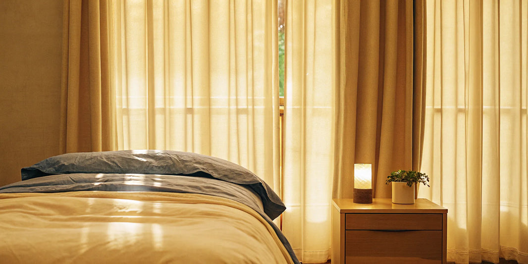 A breathable queen size cooling weighted blanket on a bed.