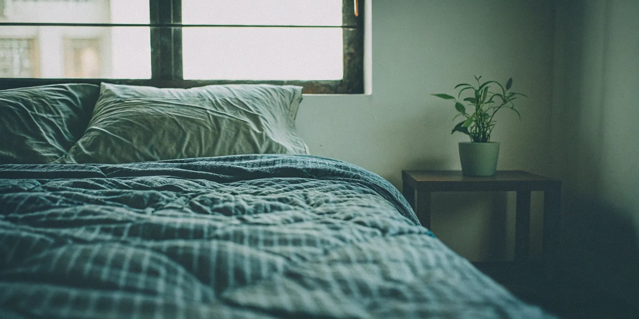 Washable weighted blanket on a bed.