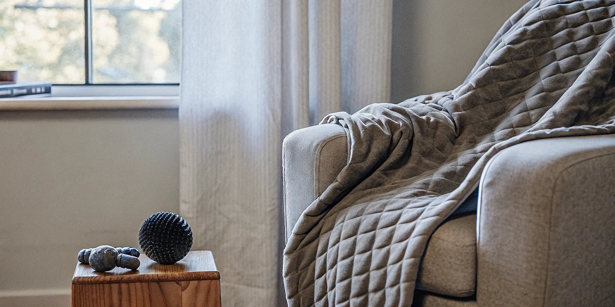 Weighted blanket on armchair. Sensory item for autism.