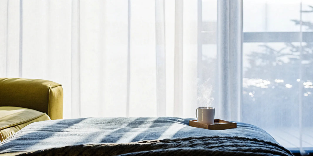 A sensory processing blanket on a bed, offering deep pressure comfort for relaxation and better sleep.