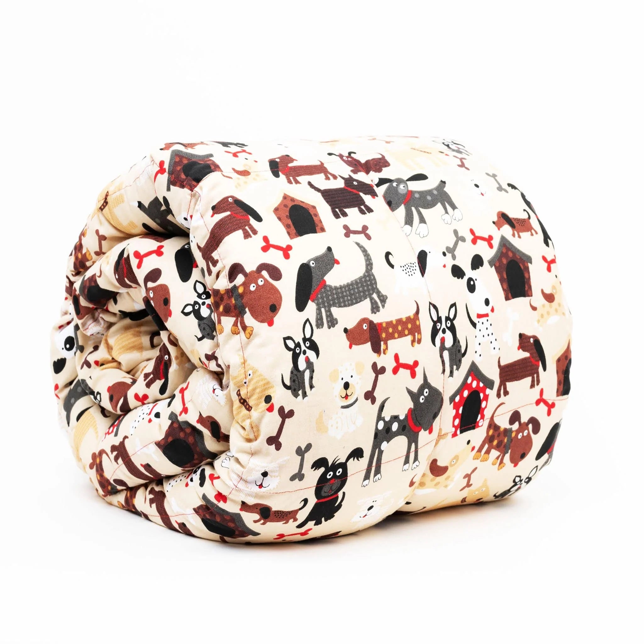 A kids' weighted blanket with a colorful dog print design, rolled up and displayed on a white background.
