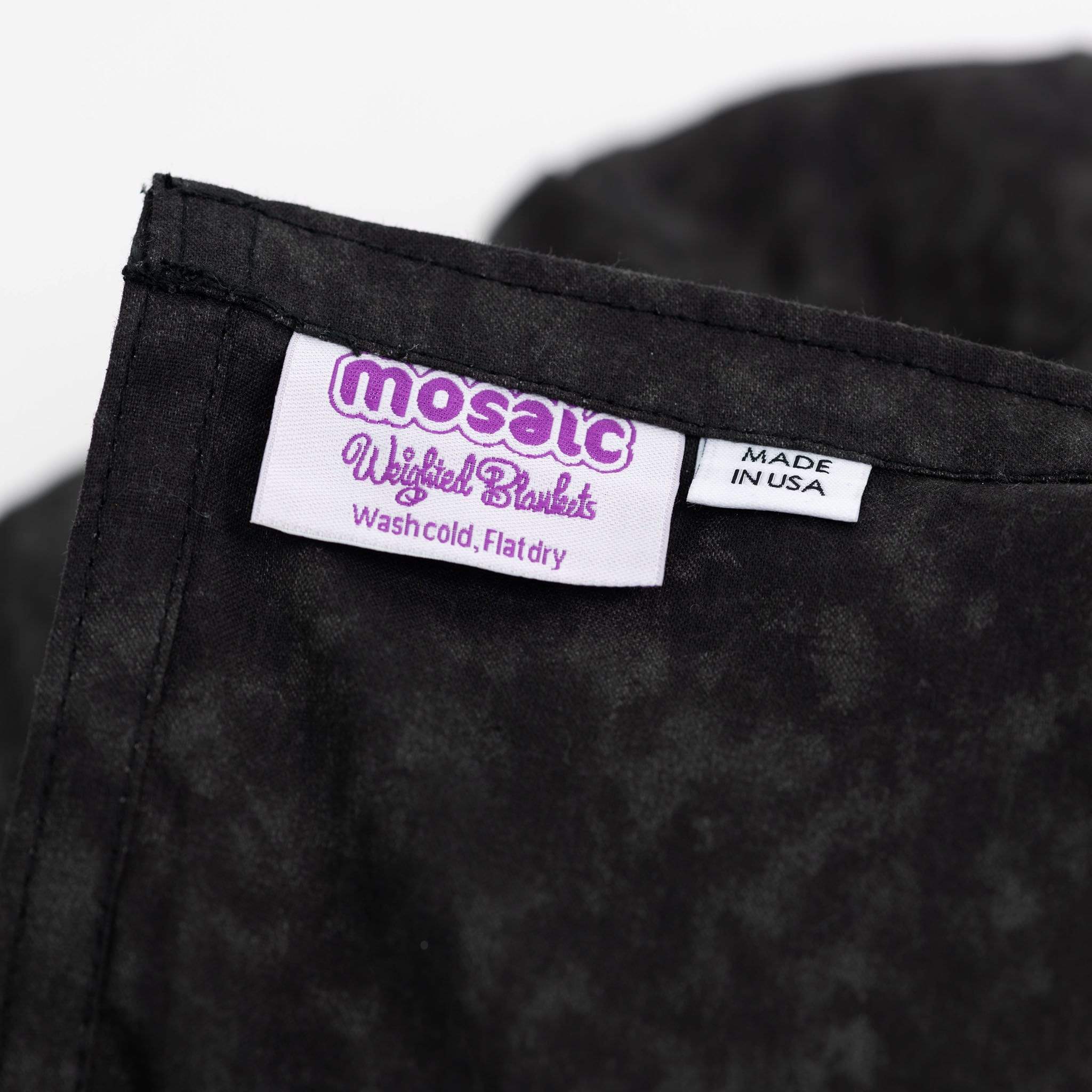 Made in America Mosaic Weighted Blankets tag on the Black Cotton Weighted Blanket