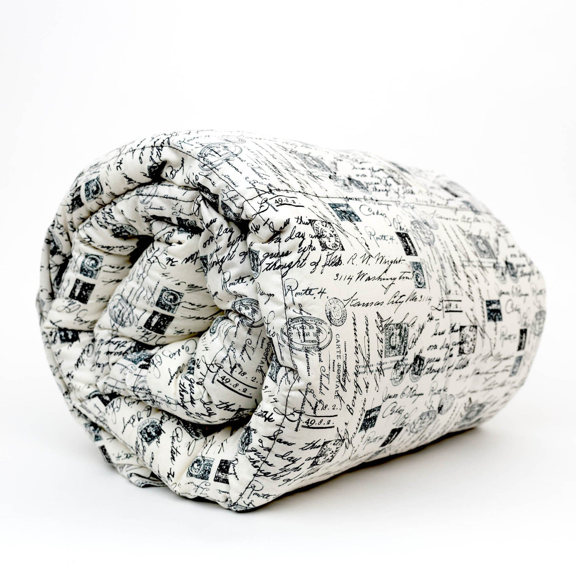 Woman sleeping under her Mosaic Weighted Blankets Letters Cotton Weighted Blanket in bed