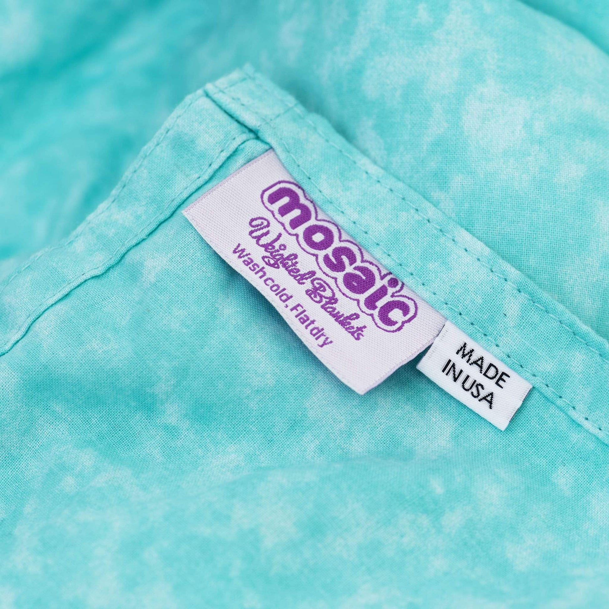 Mosaic Weighted Blankets Light Aqua Weighted Blanket closeup with Made in America tag