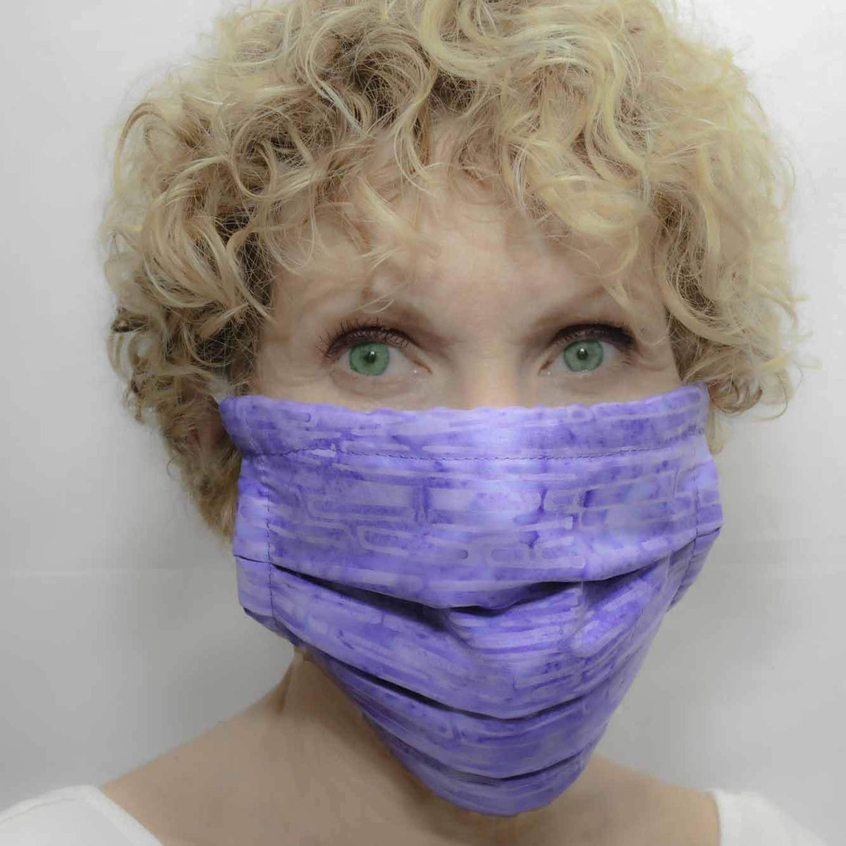 Woman wearing her Mosaic Weighted Blankets Washable Mask - Purple Batik